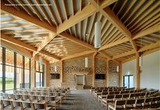Chairs lined up in ceremony room beneath wood-vaulted ceiling at the new Hemel Hempstead Crematorium