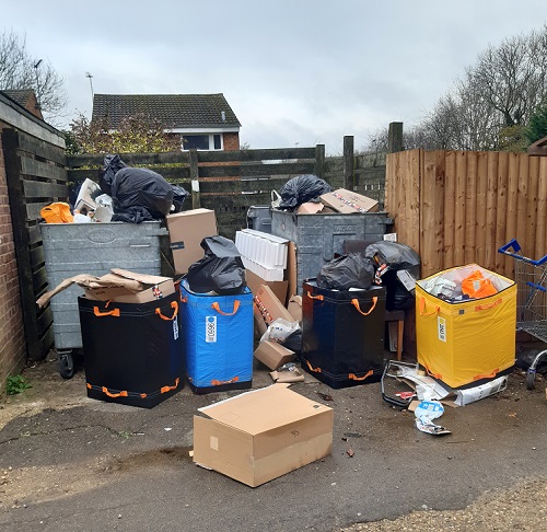 Dumped waste and overflowing bins in Roydon Court, Hemel Hempstead